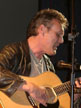 Anthony Head with guitar