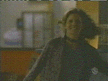 Joyce watching Giles breaking the window