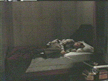 Buffy curled up on Angel's bed